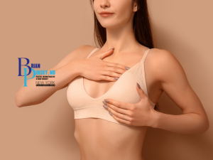 Woman in a beige bra performs a breast self-exam against a beige background, highlighting the importance of monitoring for breast changes; a plastic surgery clinic logo appears on the left side of the image.